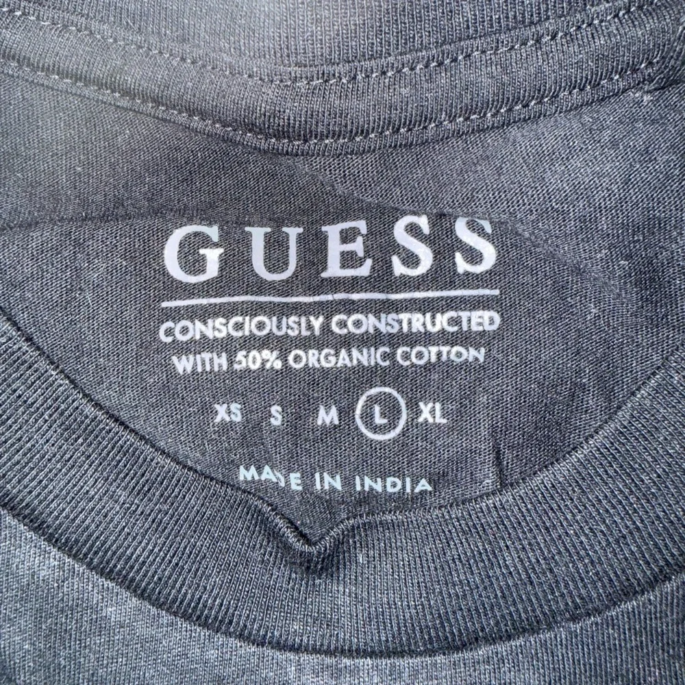 GUESS Black Tee with Vibrant Lion Graphic - Picture 2 of 5